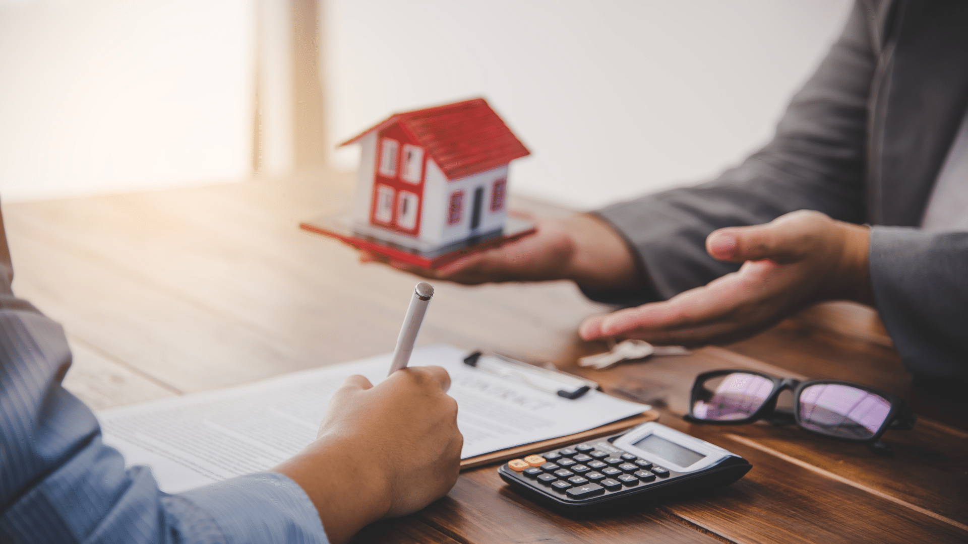 Real estate discussion with model house